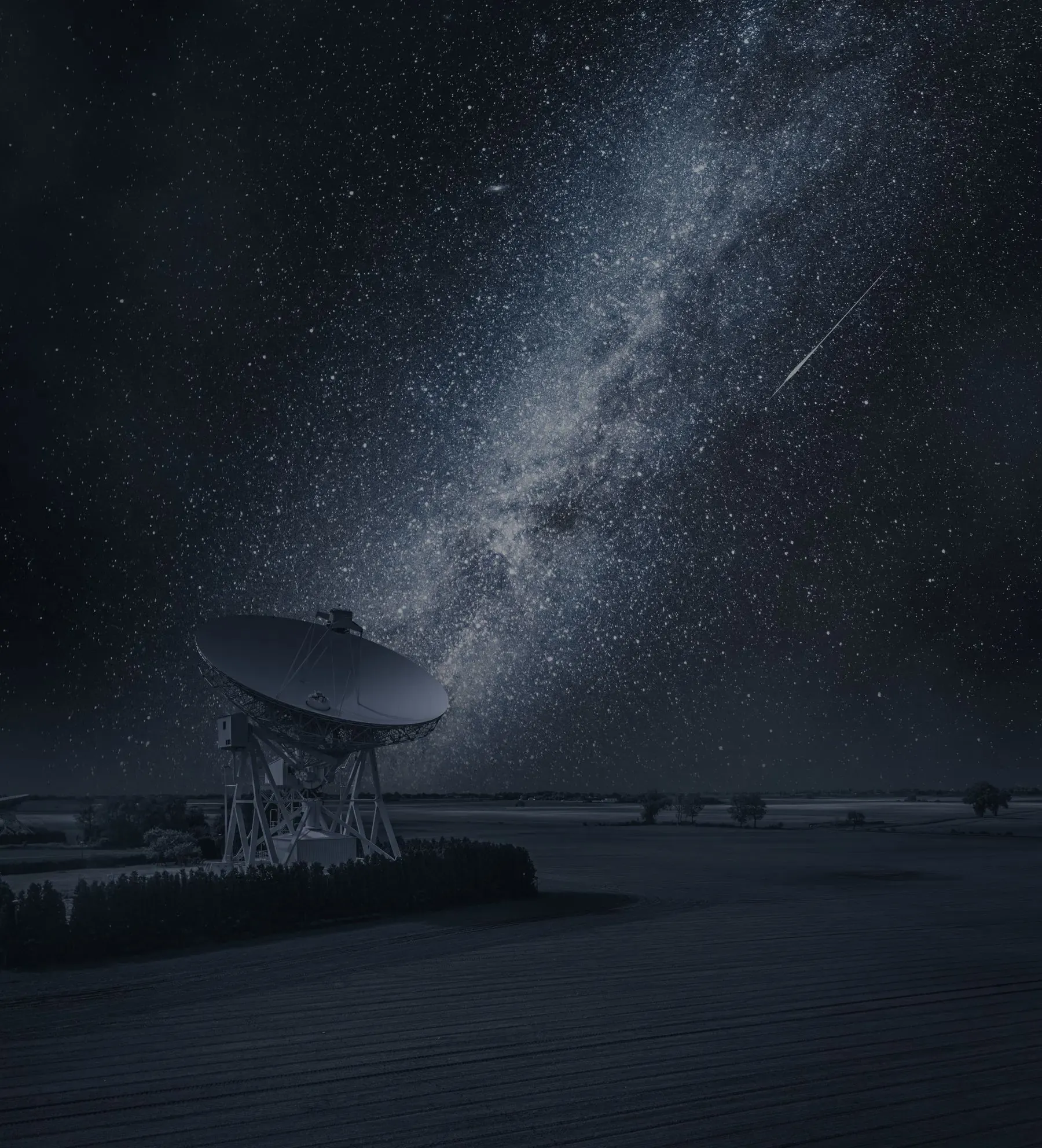 Ground-based radar dish under a star-filled night sky