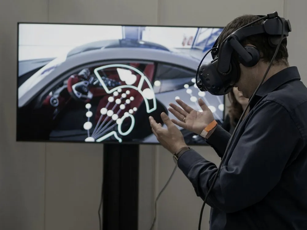 Trainee wearing a VR headset interacting with a simulation display